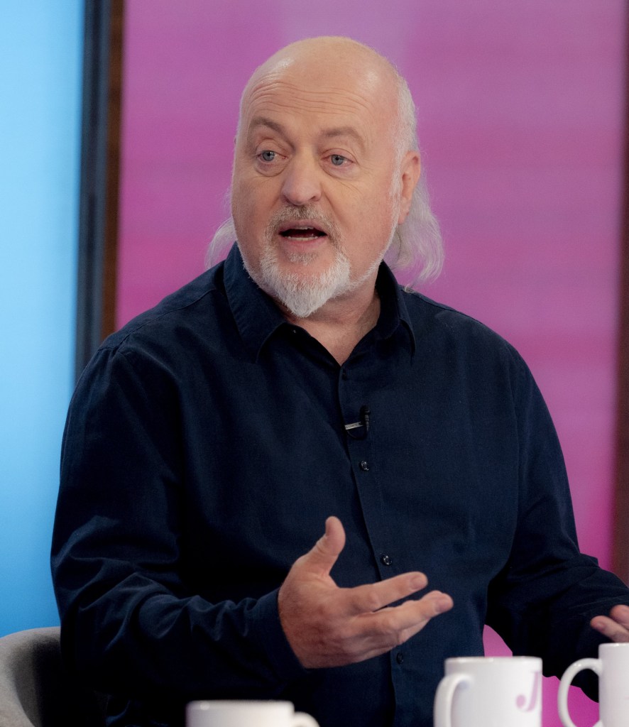 Bill Bailey on Loose Women, wearing a dark shirt and gesturing with his hands as he talks