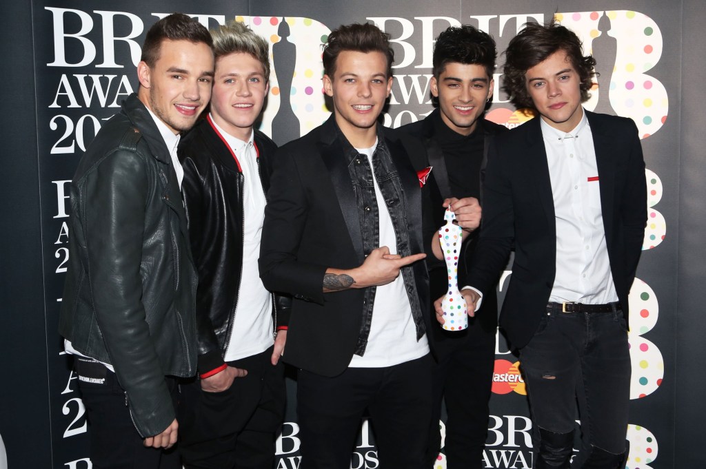 One Direction bandmates Liam Payne, Niall Horan, Louis Tomlinson, Zayn Malik and Harry Styles pose with their Brits Global Success Award