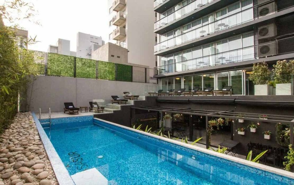 An image of the pool and balconies at the Casa Sur Palermo hotel in Buenos Aires, Argentina