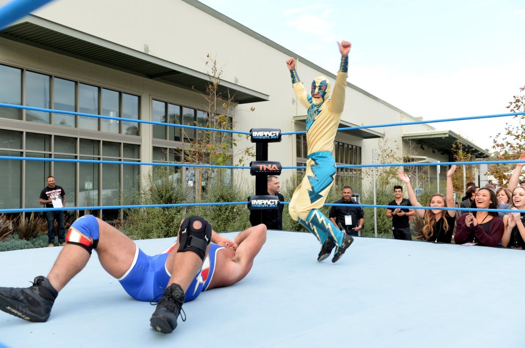 Kurt Angle (L) and Liam Payne in the ring during One Direction celebrates 1D Day at YouTube Space LA in 2013