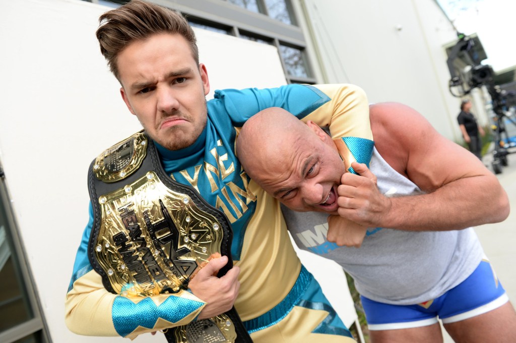 Liam Payne (L) and WWE legend Kurt Angle during One Direction celebrates 1D Day at YouTube Space LA