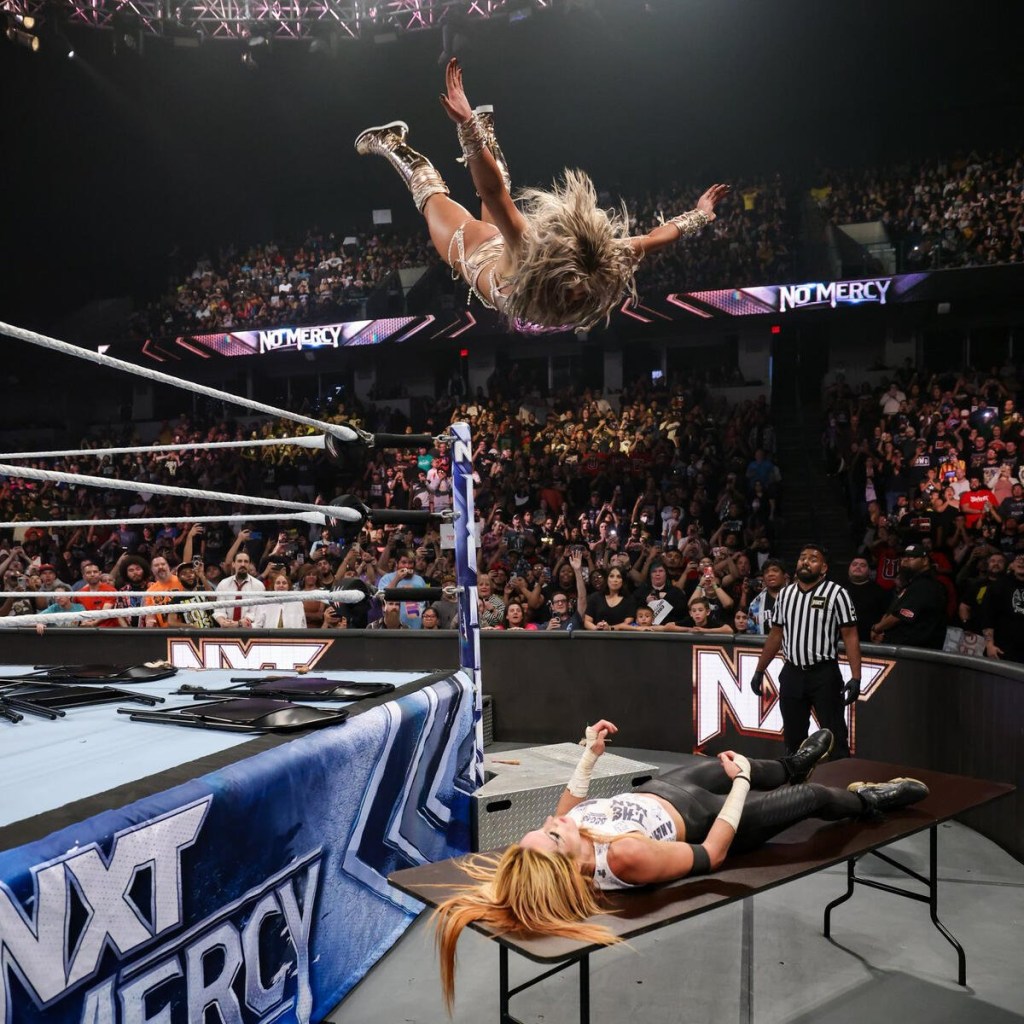 WWE superstar Tiffany Stratton hits Swanton Bomb onto Becky Lynch through a table at NXT No Mercy 2023